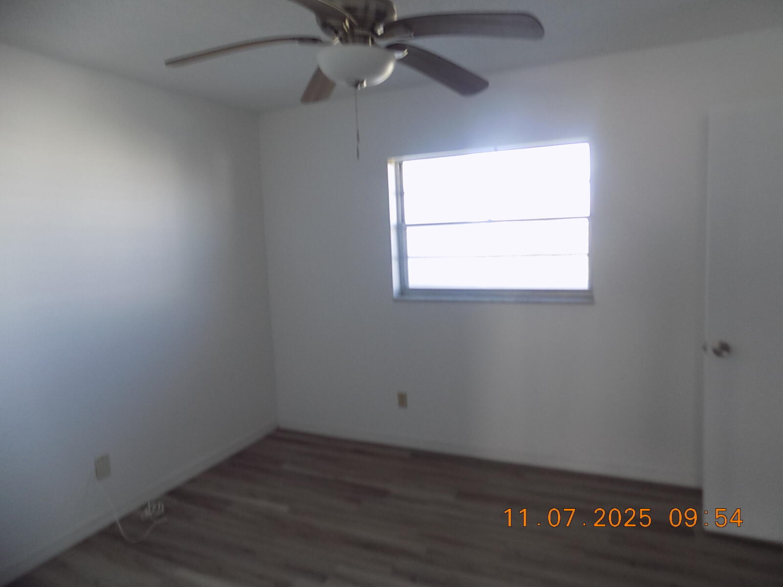 231 East Lantana Road, Unit 501 Lantana, FL 33462 - Photo 12 of 18 an empty room with a window and wooden floor