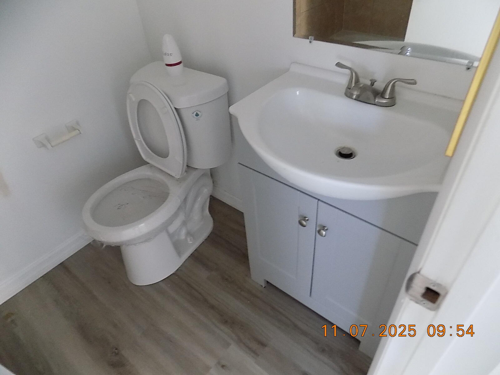 231 East Lantana Road, Unit 501 Lantana, FL 33462 - Photo 13 of 18 a bathroom with a toilet sink and mirror