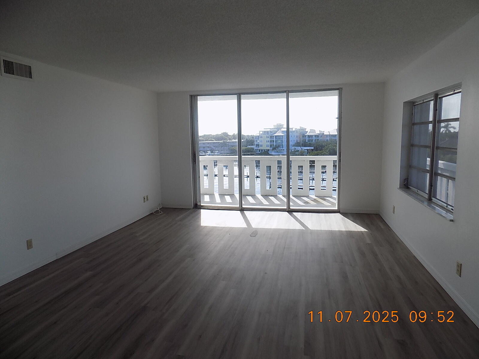 231 East Lantana Road, Unit 501 Lantana, FL 33462 - Photo 6 of 18 wooden floor in an empty room with a window