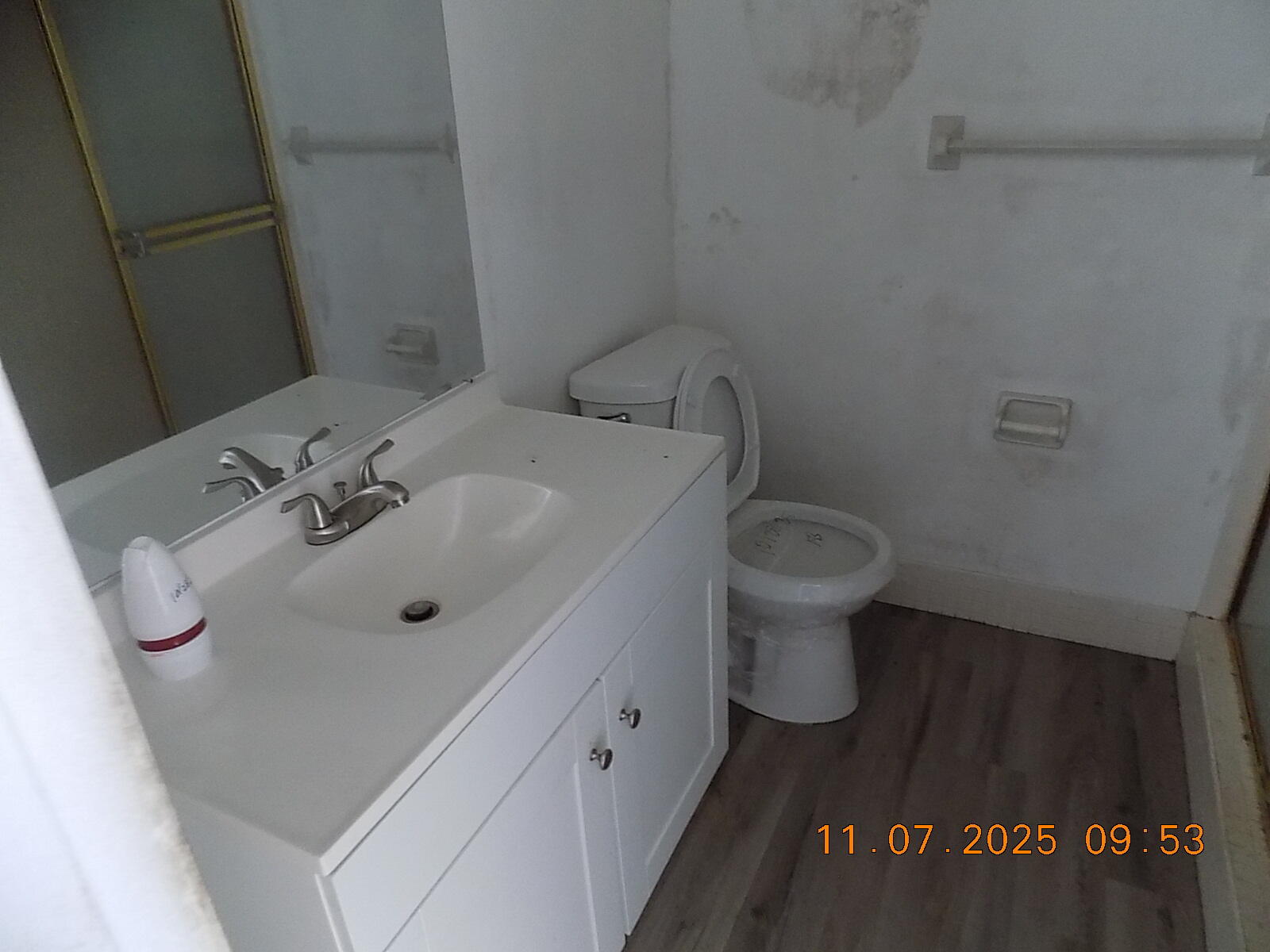 231 East Lantana Road, Unit 501 Lantana, FL 33462 - Photo 8 of 18 a bathroom with a sink a toilet and a mirror