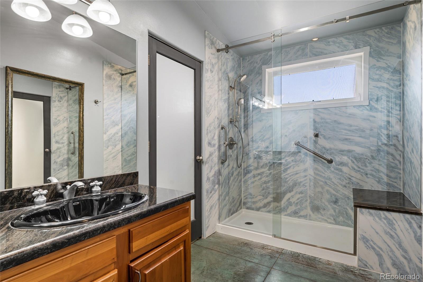 53997 County Rd LL56 Villa Grove, CO 81155 - Photo 14 of 34 a bathroom with a sink and a mirror
