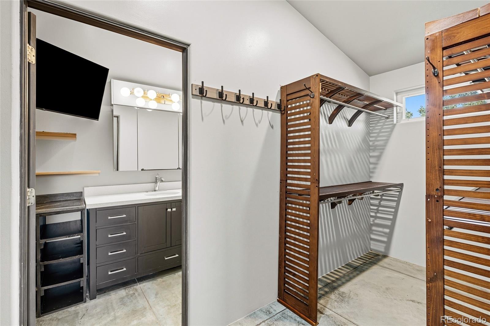 53997 County Rd LL56 Villa Grove, CO 81155 - Photo 15 of 34 a bathroom with a sink and a mirror