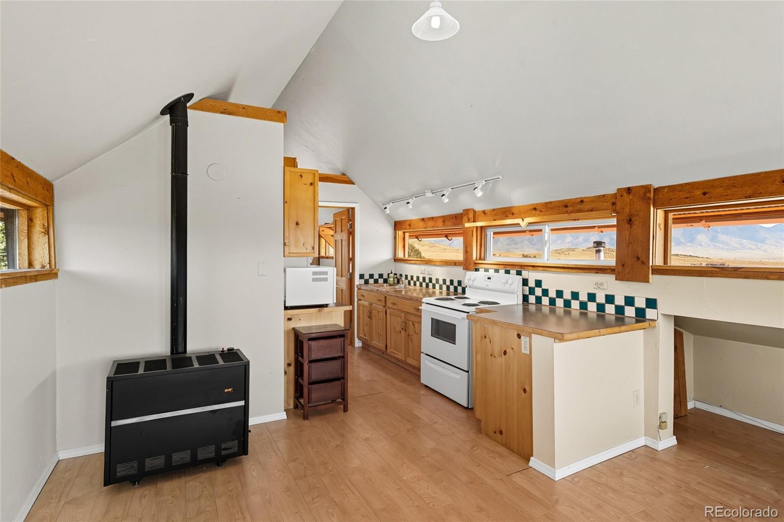 53997 County Rd LL56 Villa Grove, CO 81155 - Photo 17 of 34 a kitchen with stove and refrigerator