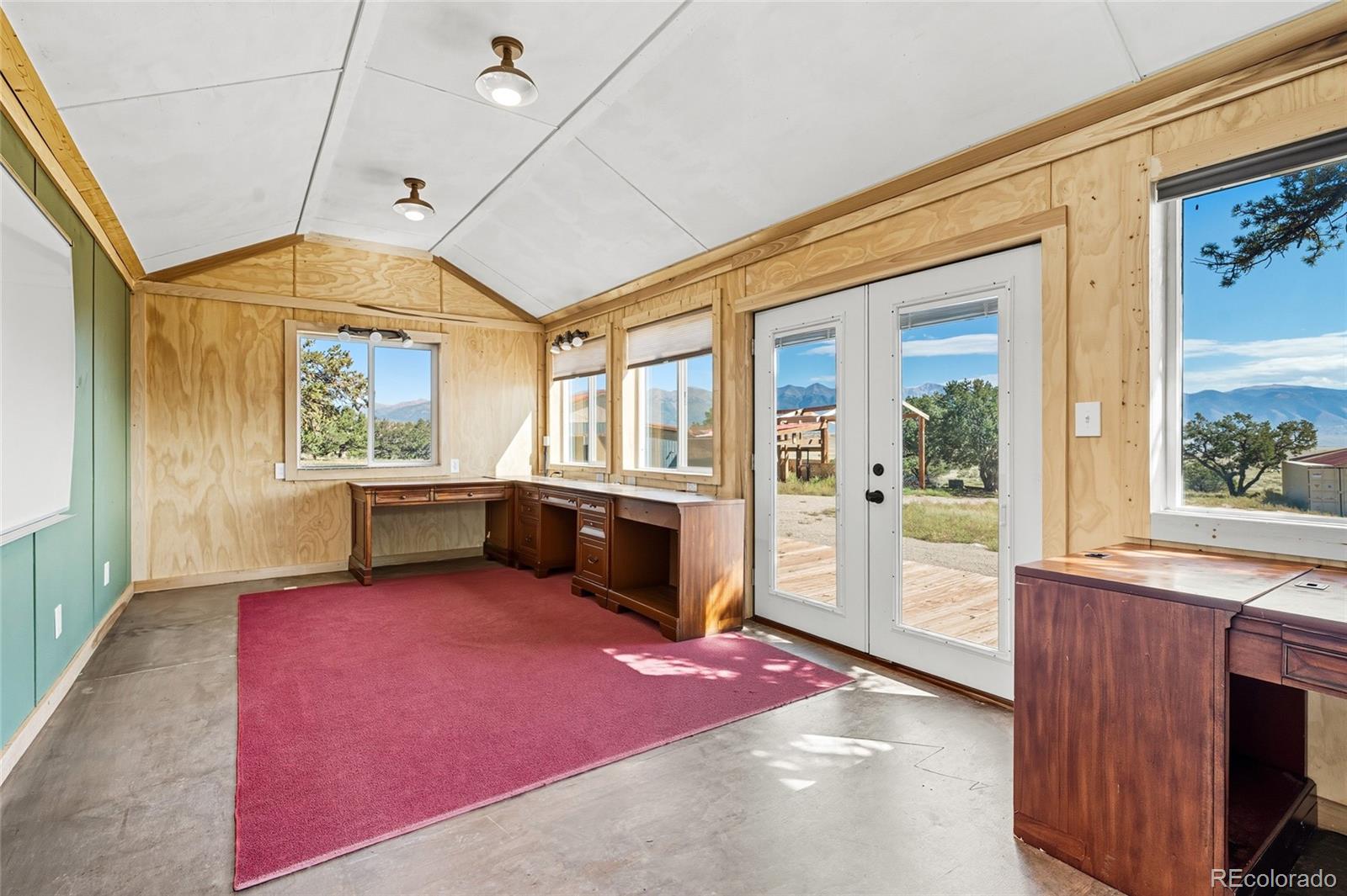 53997 County Rd LL56 Villa Grove, CO 81155 - Photo 21 of 34 a view of an empty room with a fireplace and a window