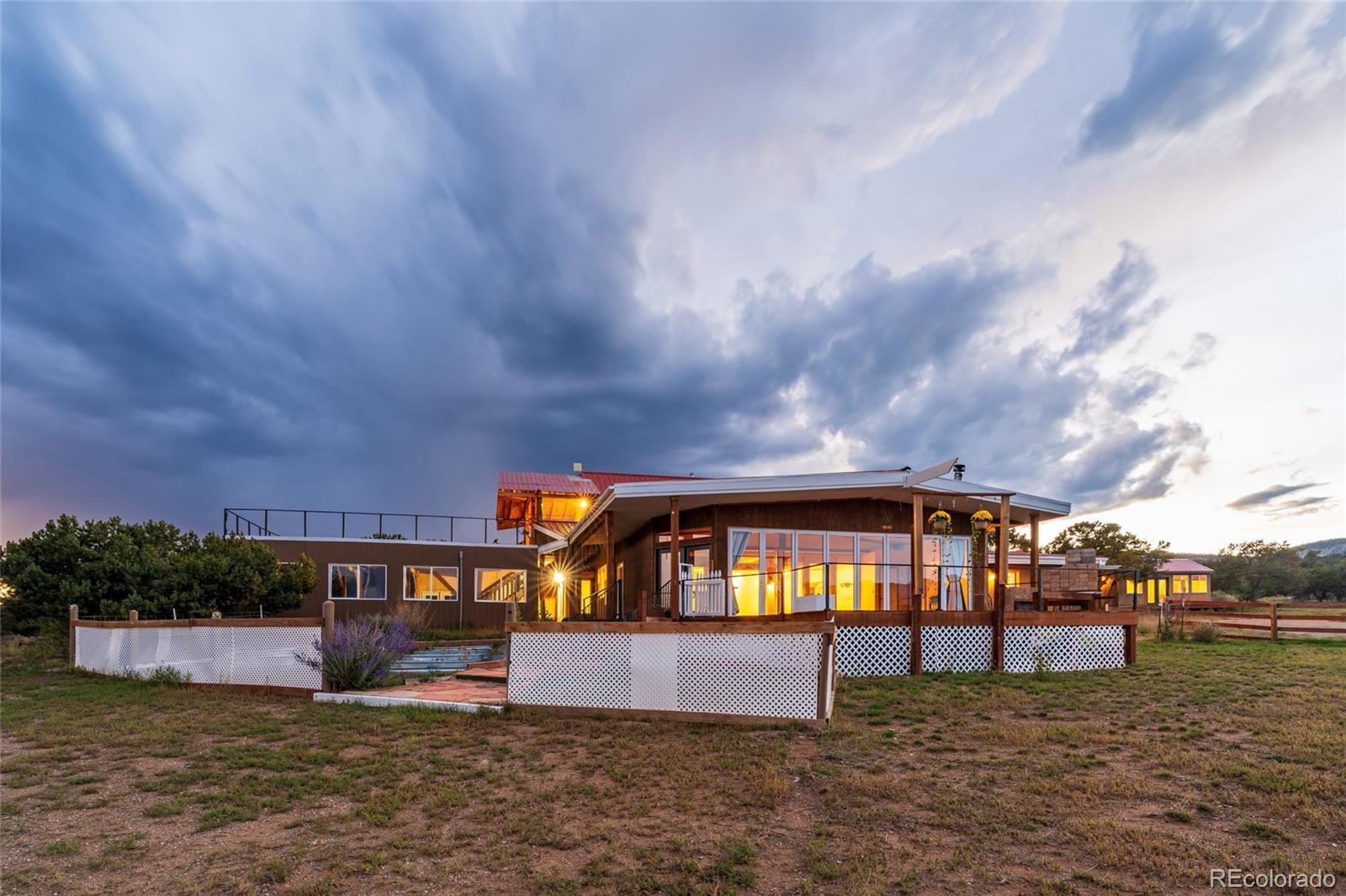 53997 County Rd LL56 Villa Grove, CO 81155 - Photo 4 of 34 a front view of a house with a yard