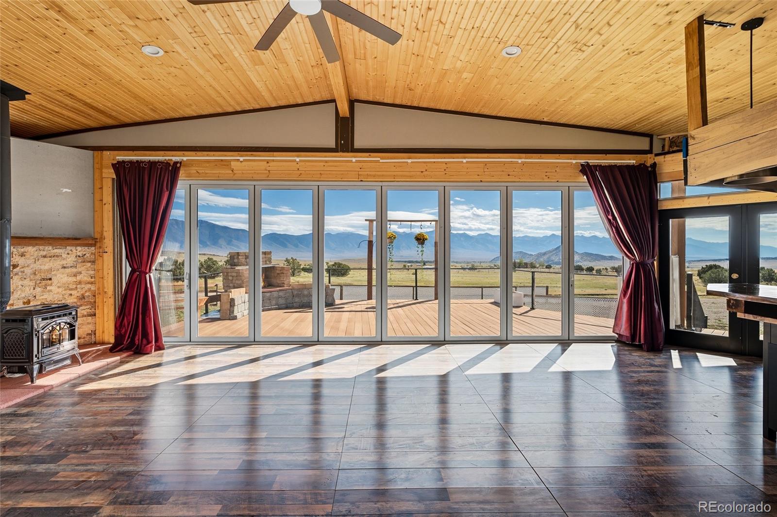 53997 County Rd LL56 Villa Grove, CO 81155 - Photo 5 of 34 a view of an empty room with wooden floor and a window