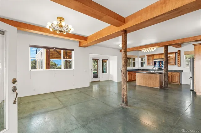 a view of kitchen with furniture and window