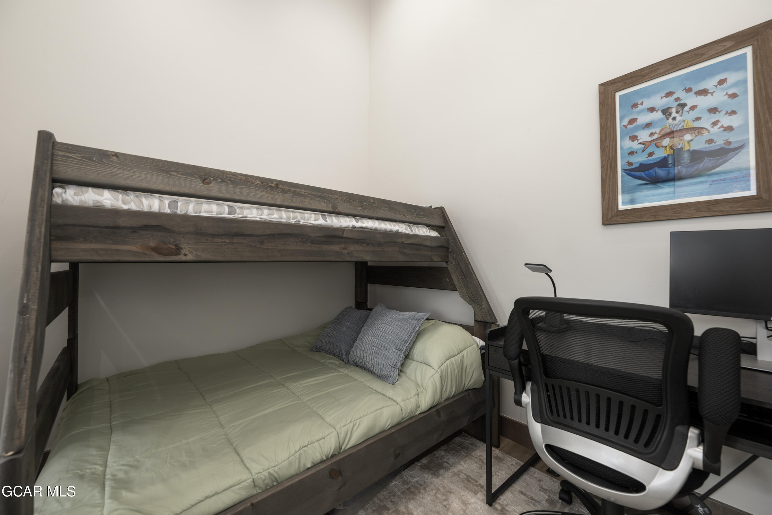 96 Meadow Trail, Unit G304 Fraser, CO 80442 - Photo 22 of 37 a bedroom with a bed and furniture