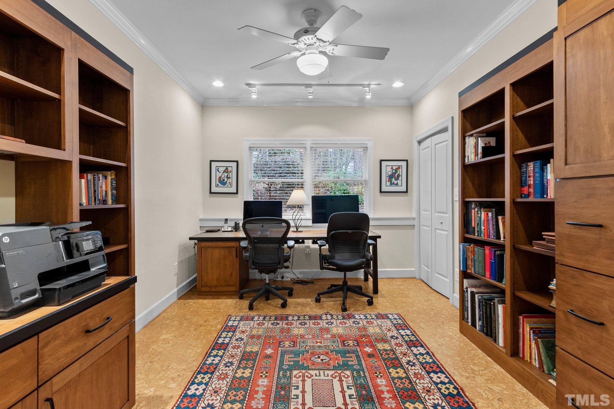3518 Ridge Road Durham, NC 27705 - Photo 15 of 47 Tucked just beyond the staircase is a study with built-in bookcases. The desk is reserved by the sellers.