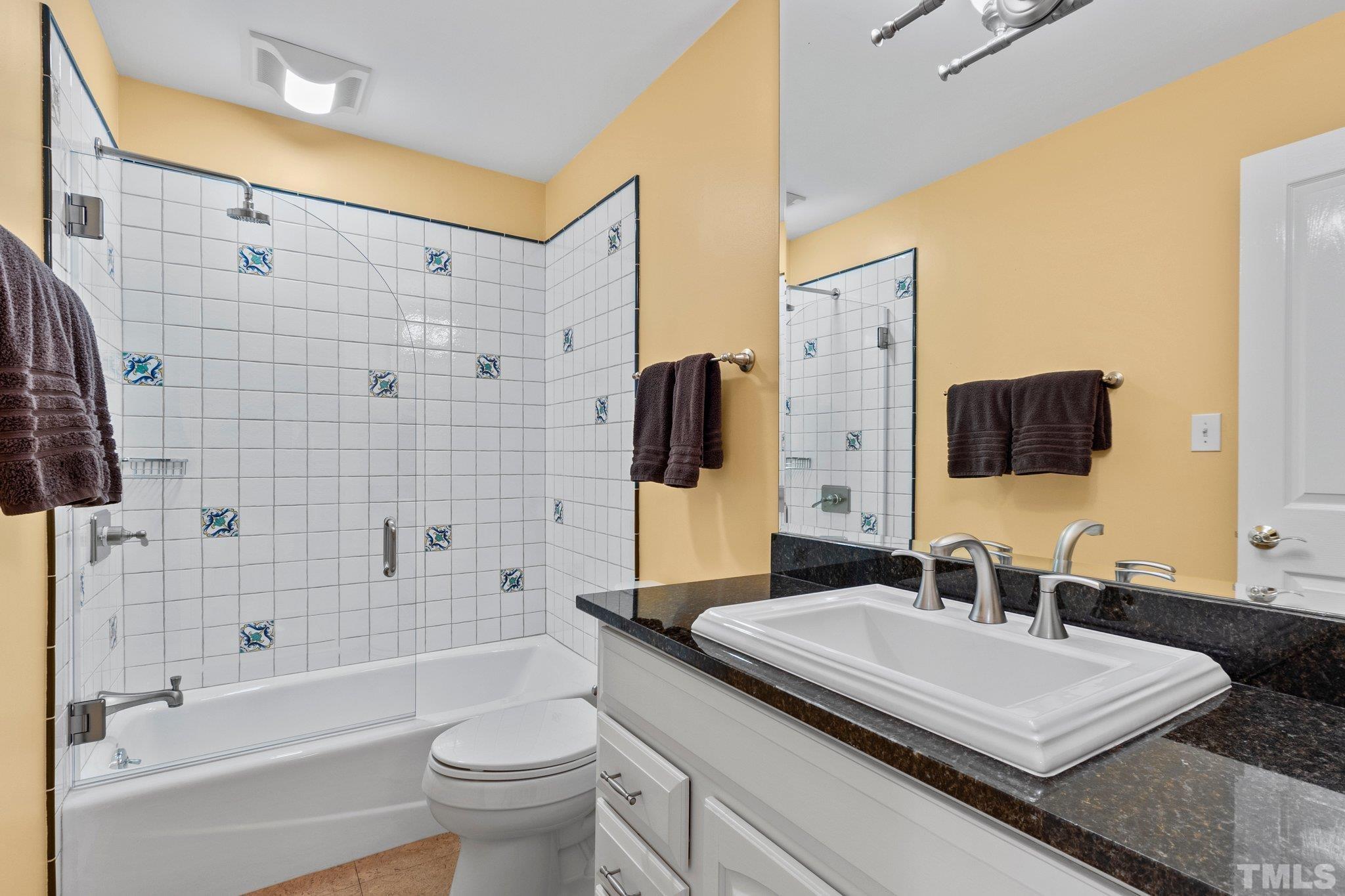 3518 Ridge Road Durham, NC 27705 - Photo 16 of 47 Pretty full bathroom on main level serves as powder room and could be guest bath with study as a sleeping option.