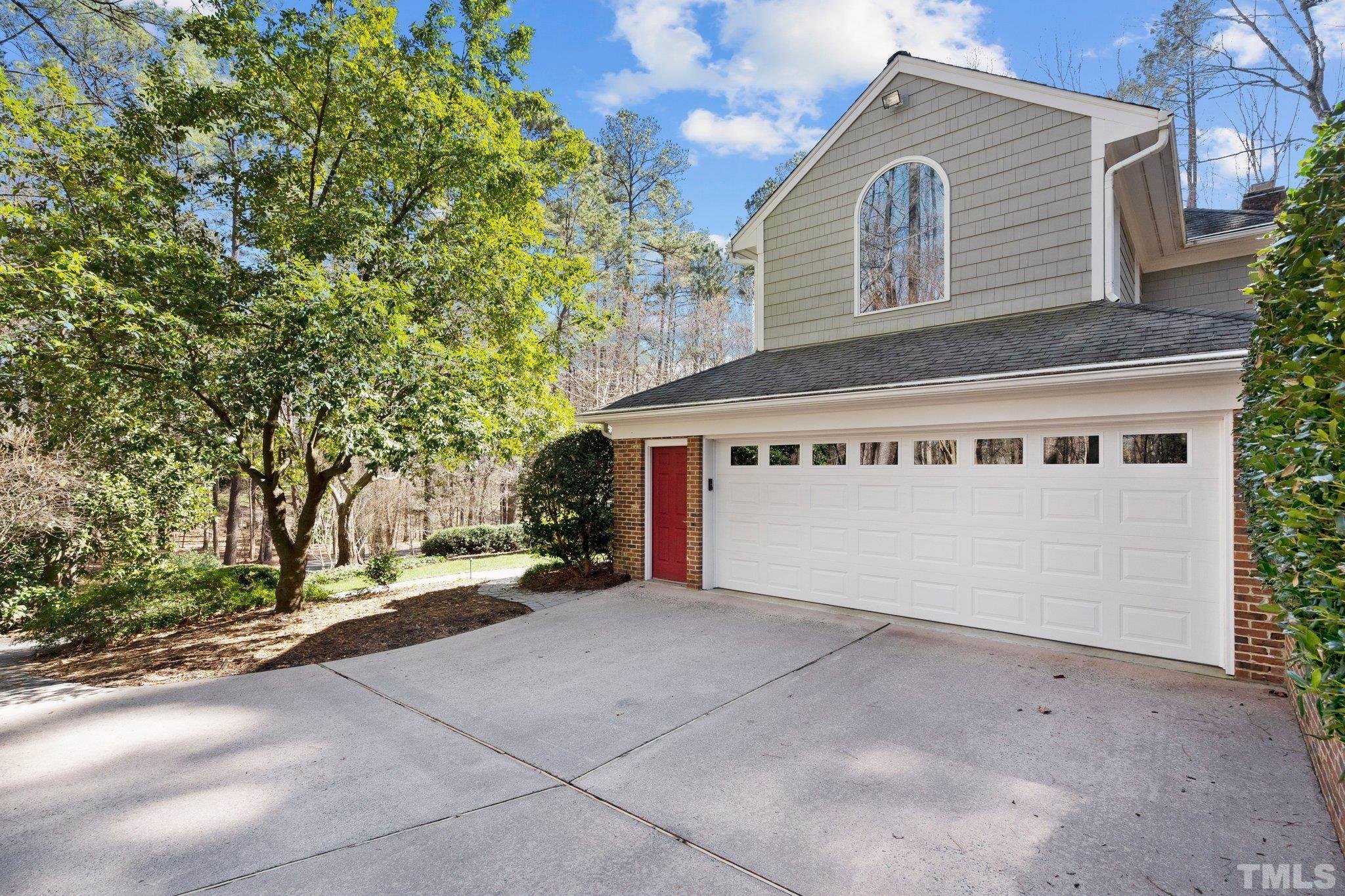3518 Ridge Road Durham, NC 27705 - Photo 18 of 47 Two car garage with passge door has ample parking outside.