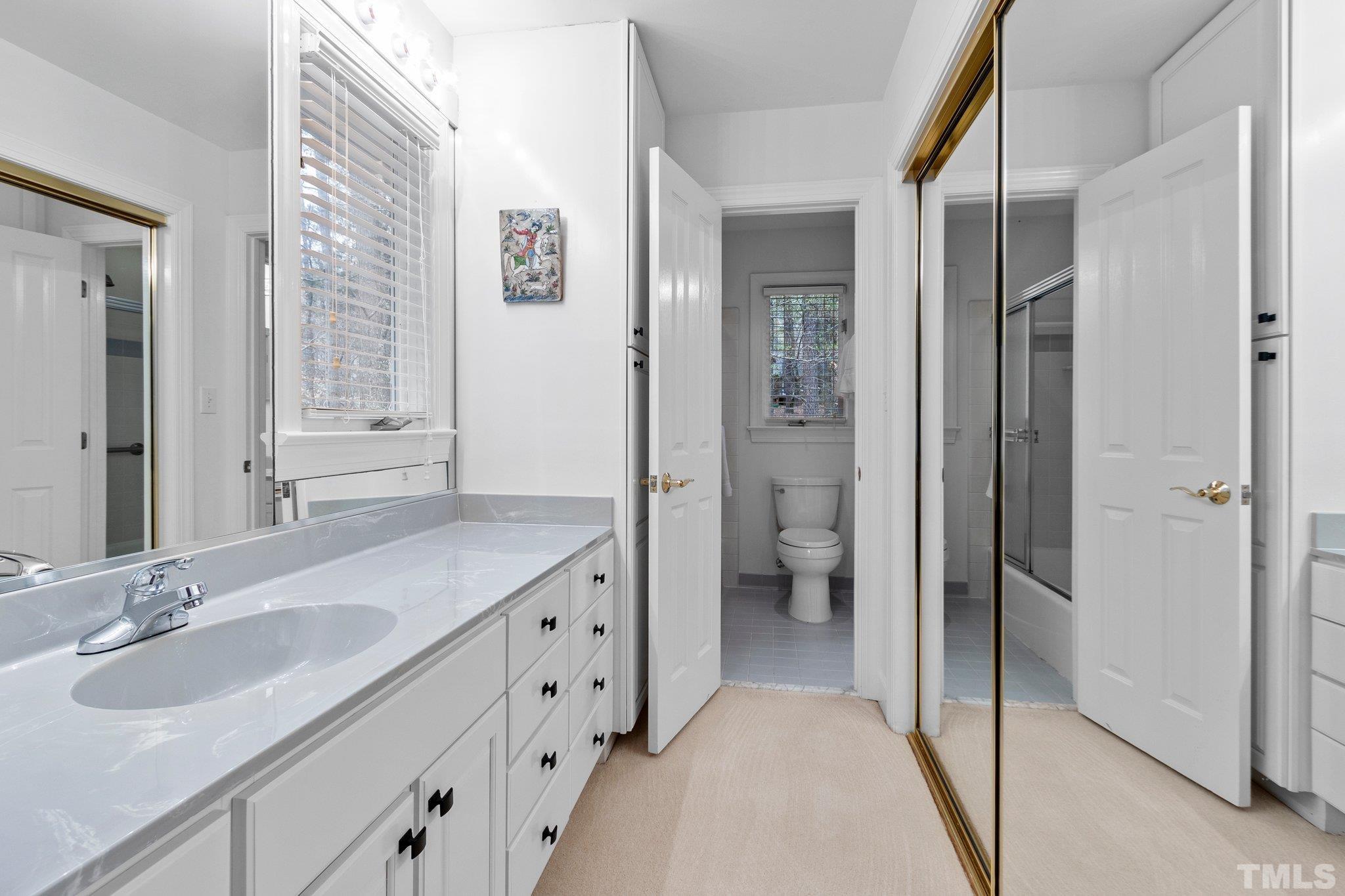 3518 Ridge Road Durham, NC 27705 - Photo 26 of 47 Jack & Jill bath includes private vanity and mirrored closet.