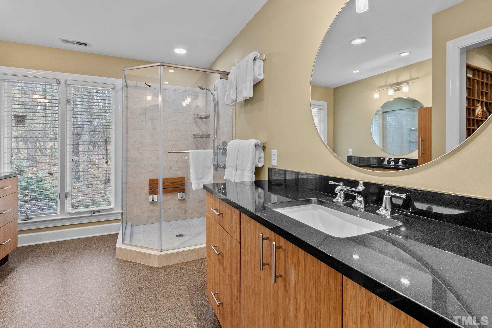 3518 Ridge Road Durham, NC 27705 - Photo 31 of 47 Stylish bath with glass shower, marmoleum floor and individual vanities.