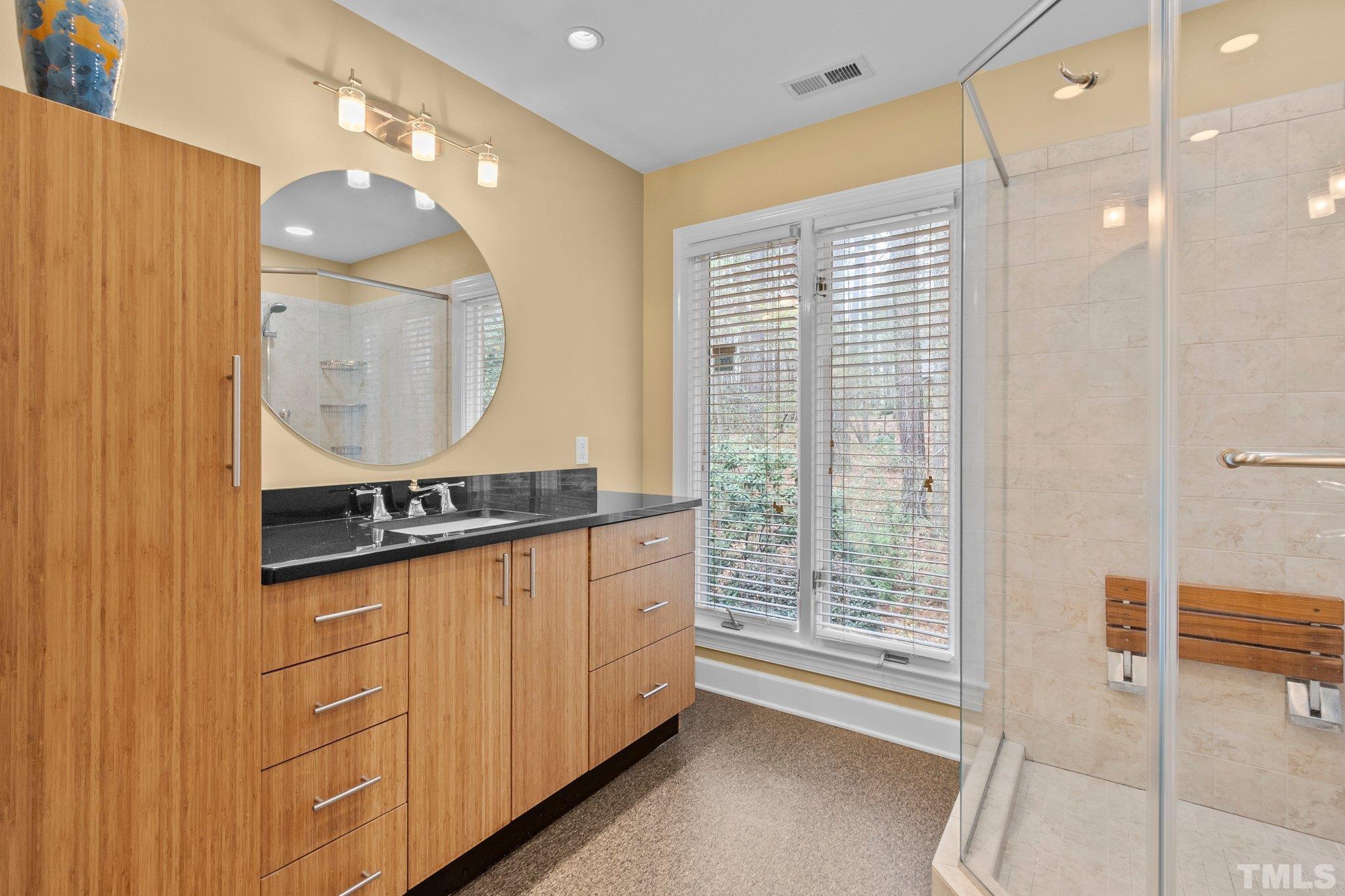 3518 Ridge Road Durham, NC 27705 - Photo 32 of 47 Individual vanities, nice lighting and plenty of space for busy morning prep.