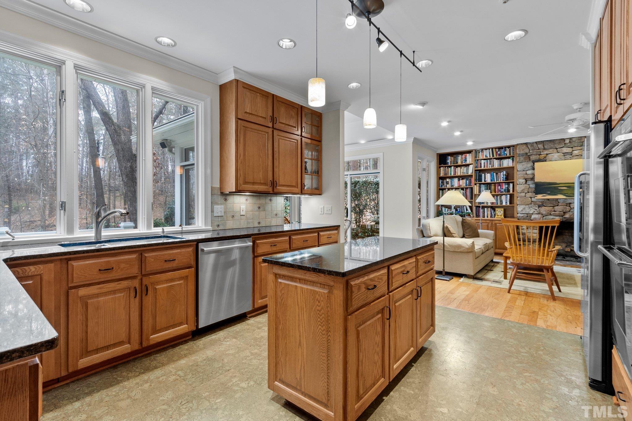 3518 Ridge Road Durham, NC 27705 - Photo 6 of 47 Well designed kitchen, handsome wood cabinetry, granite countertops, stainless appliances. The perfect spot for the family chef.