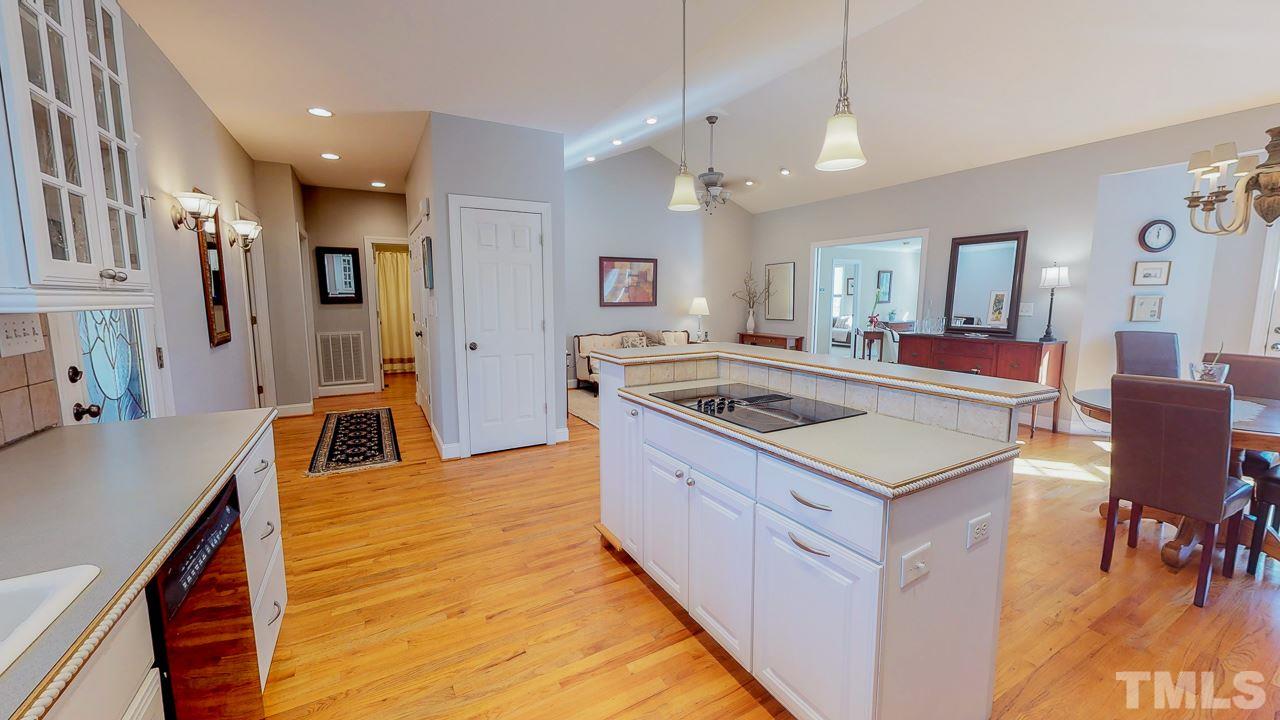 522 Edwin Court Roxboro, NC 27573 - Photo 3 of 24 a kitchen that has a lot of cabinets a sink and a stove