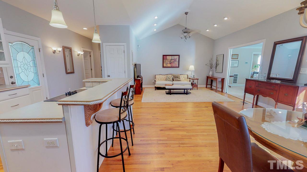 522 Edwin Court Roxboro, NC 27573 - Photo 4 of 24 a living room with furniture a dining table and chairs