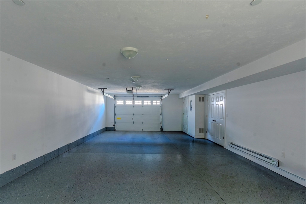 2 Mitchell Lane, Unit B Weymouth, MA 02190 - Photo 25 of 31 an empty room with a empty space and windows