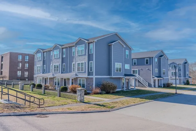 an aerial view of houses with outdoor space