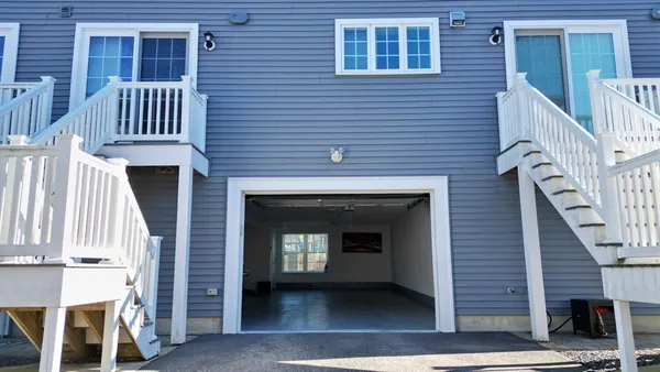 a front view of a house with a porch