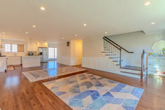 a view of kitchen with cabinets and wooden floor