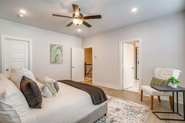 a bedroom with a bed and a chair