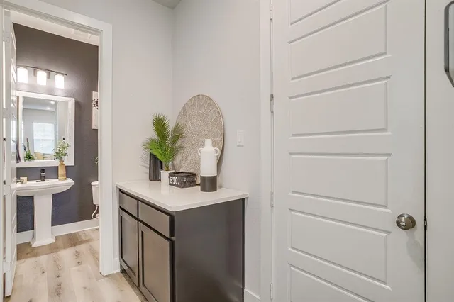 a room with a sink and a mirror