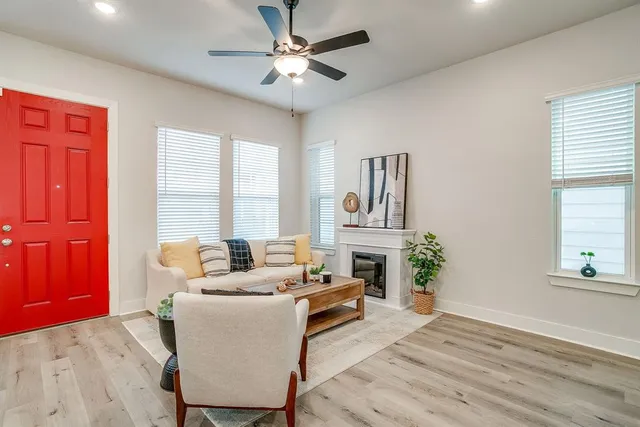 a living room with furniture and a fireplace