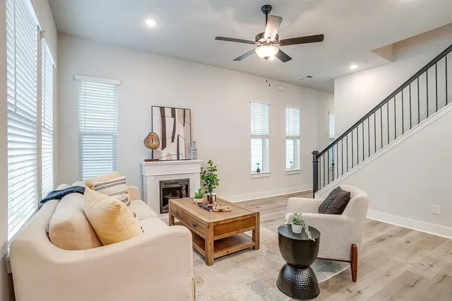 a living room with furniture and a fireplace