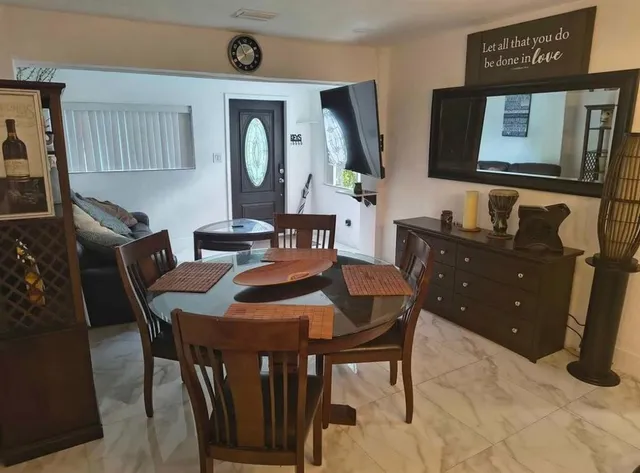 a view of a dining room with furniture