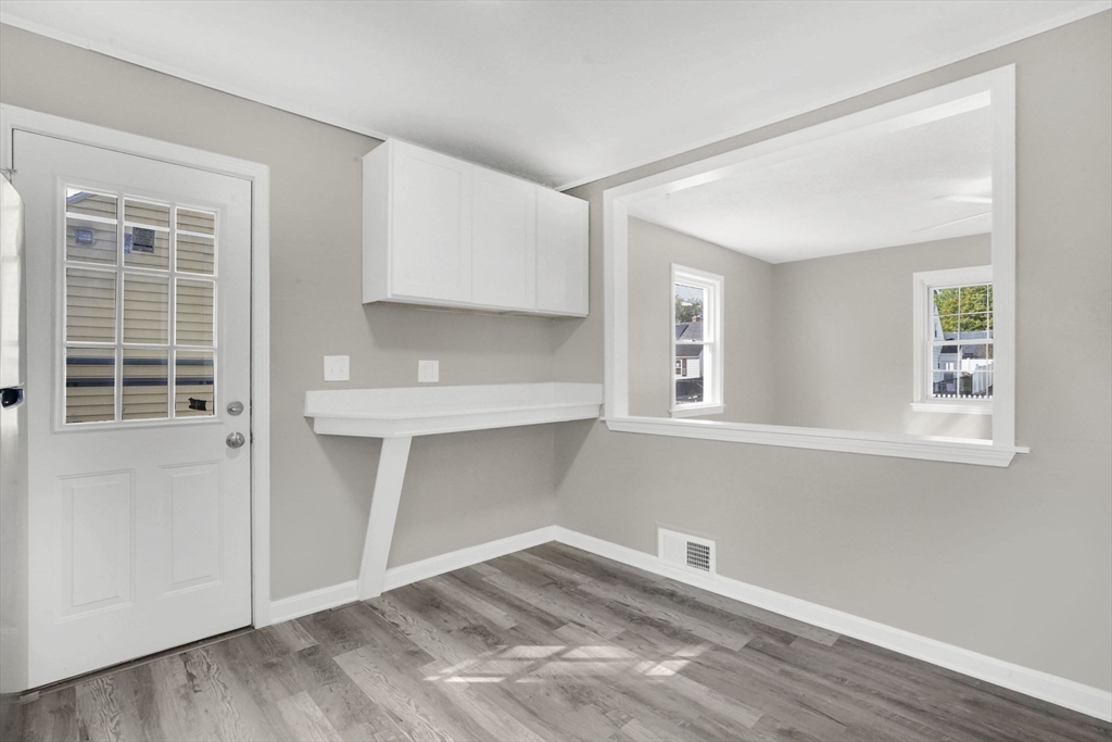 55 Pheland Street Springfield, MA 01109 - Photo 11 of 28 a view of empty room with wooden floor and fan