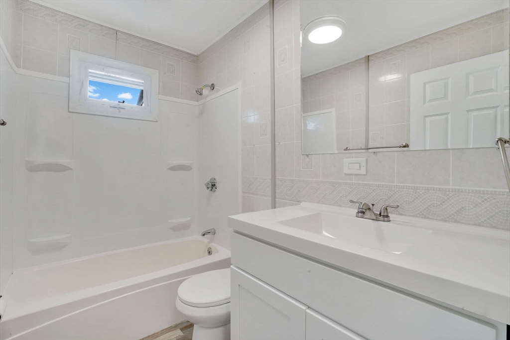 55 Pheland Street Springfield, MA 01109 - Photo 13 of 28 a bathroom with a sink a toilet and a bathtub