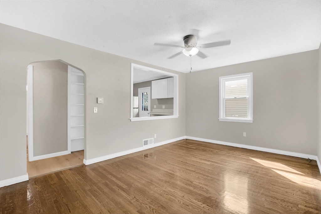55 Pheland Street Springfield, MA 01109 - Photo 4 of 28 a view of empty room with wooden floor and fan