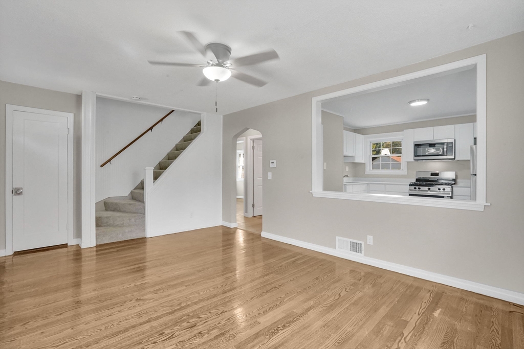 55 Pheland Street Springfield, MA 01109 - Photo 5 of 28 a view of empty room with wooden floor and fan