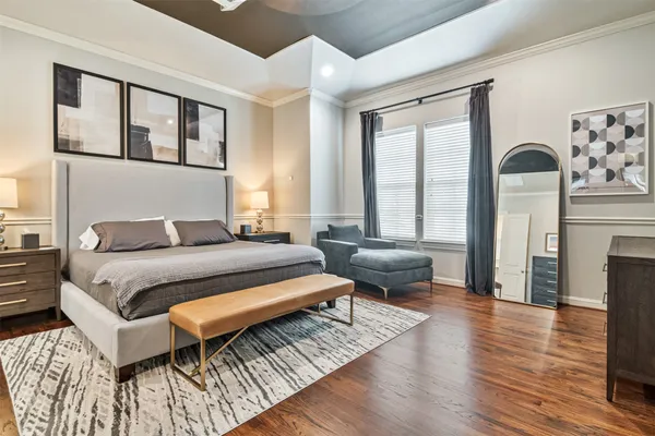 a bedroom with a bed and a couch