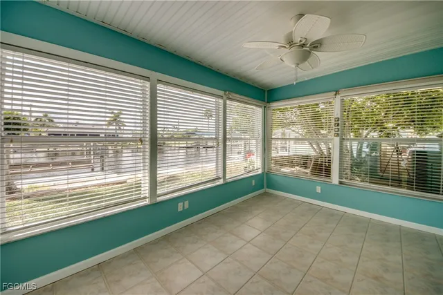 a living room with a window and a bathroom
