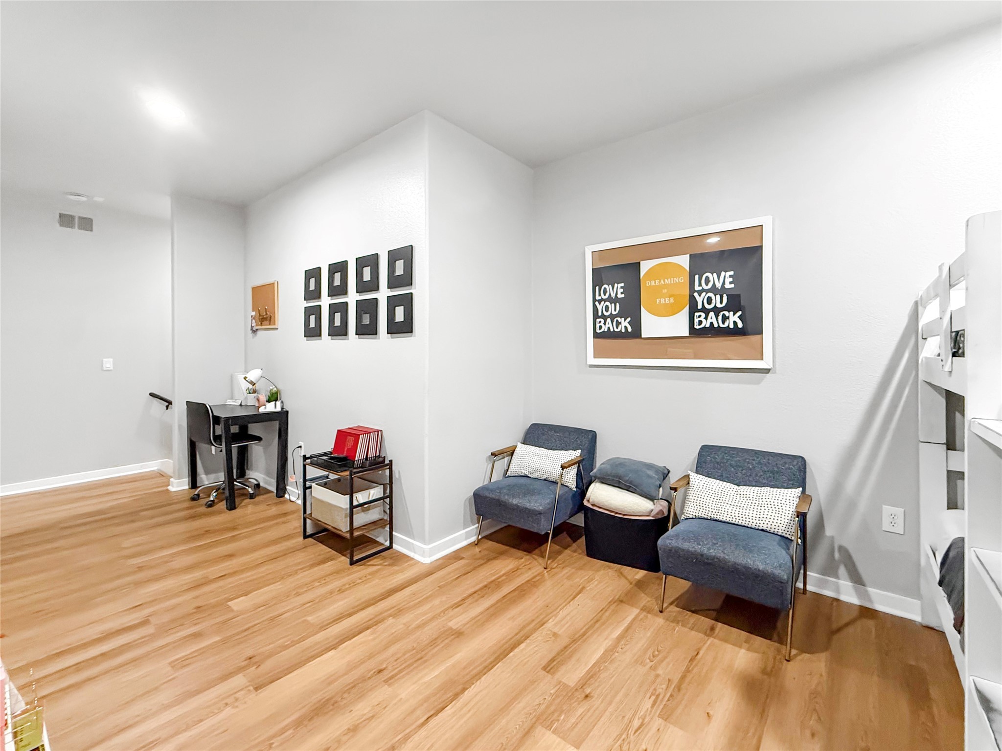 2216 Chenevert Street, Unit 4 Houston, TX 77003 - Photo 11 of 23 a room with furniture and wooden floor