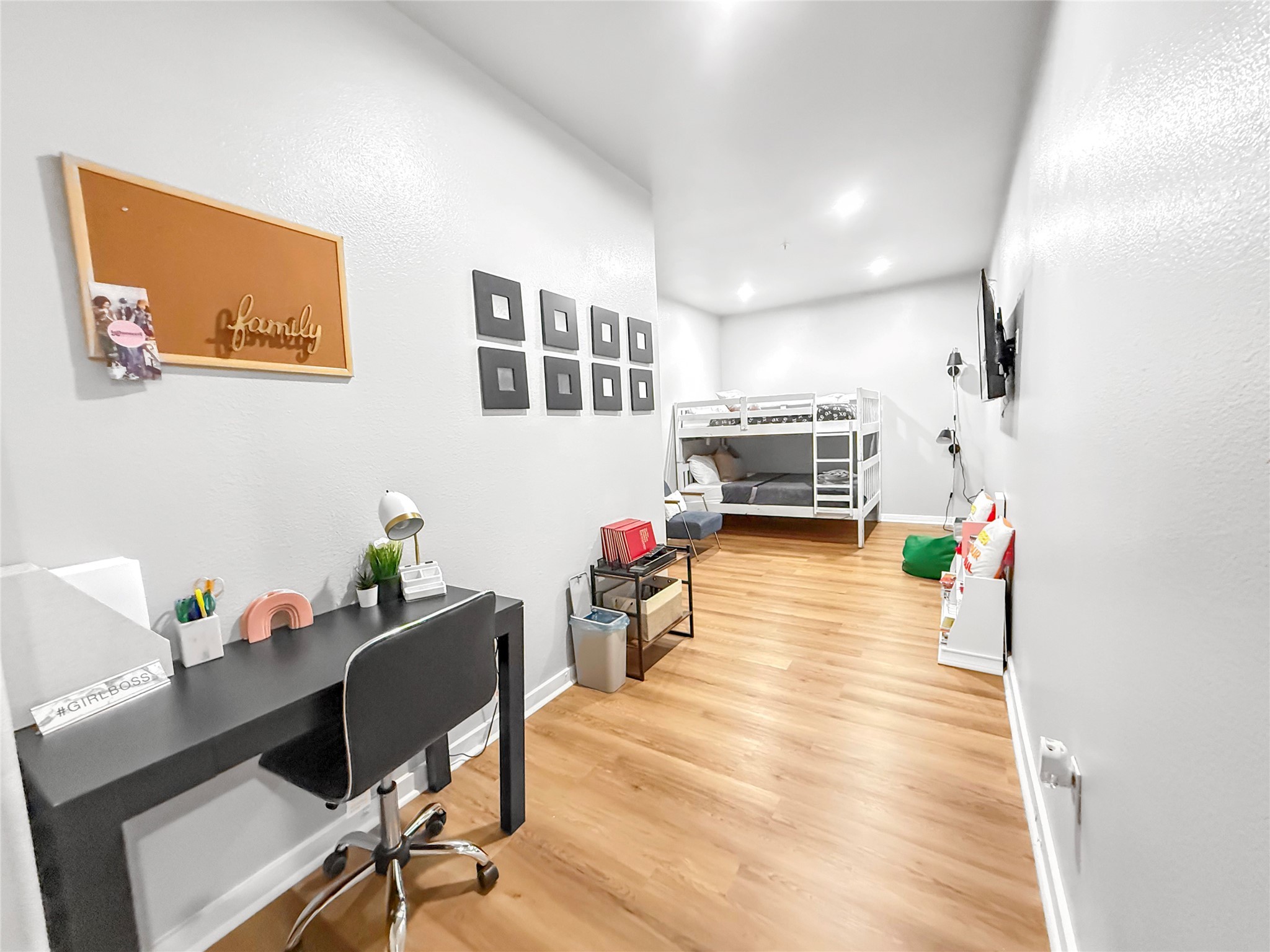 2216 Chenevert Street, Unit 4 Houston, TX 77003 - Photo 12 of 23 a living room with furniture and a flat screen tv