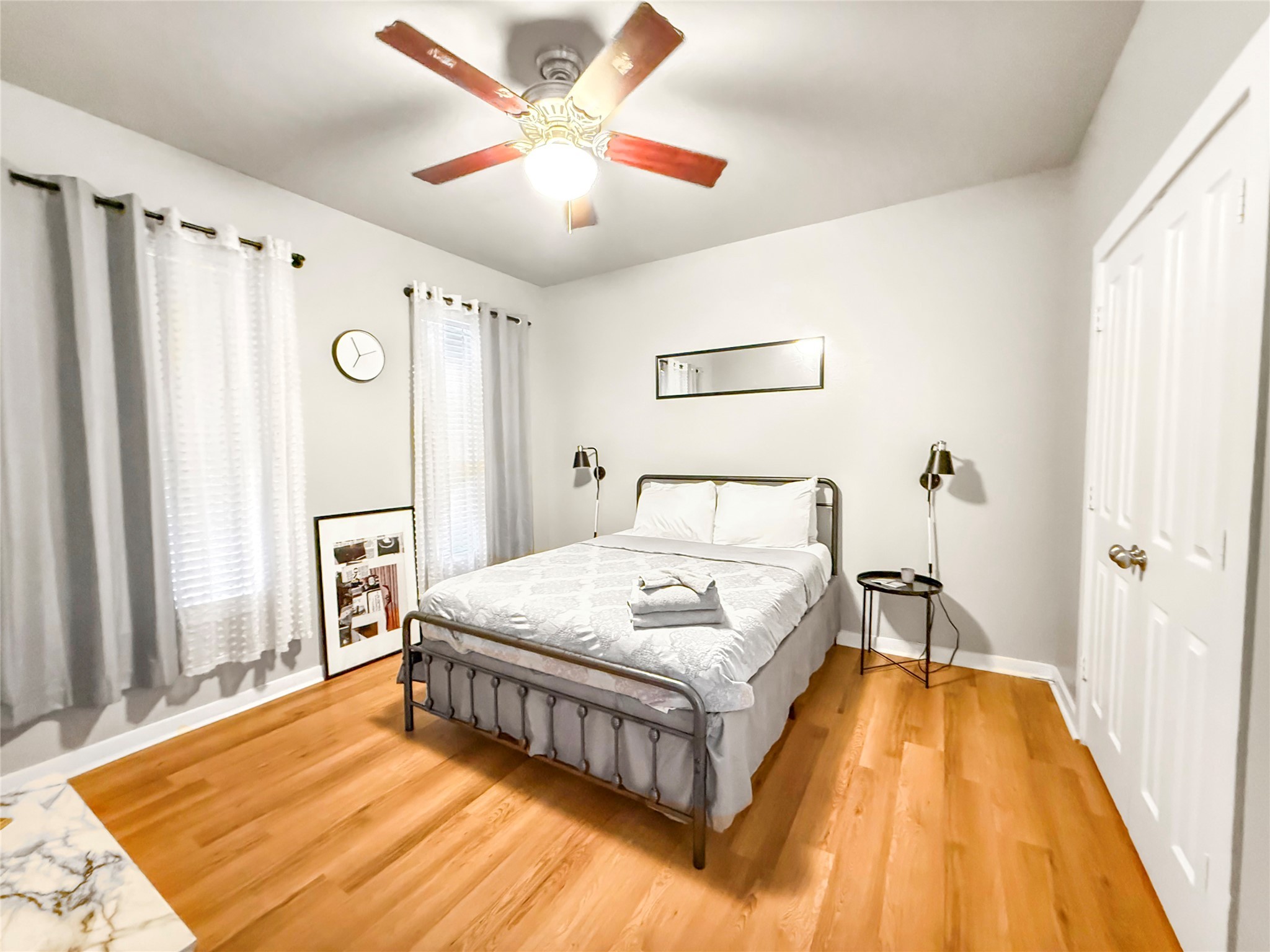 2216 Chenevert Street, Unit 4 Houston, TX 77003 - Photo 14 of 23 a spacious bedroom with a bed and a chandelier