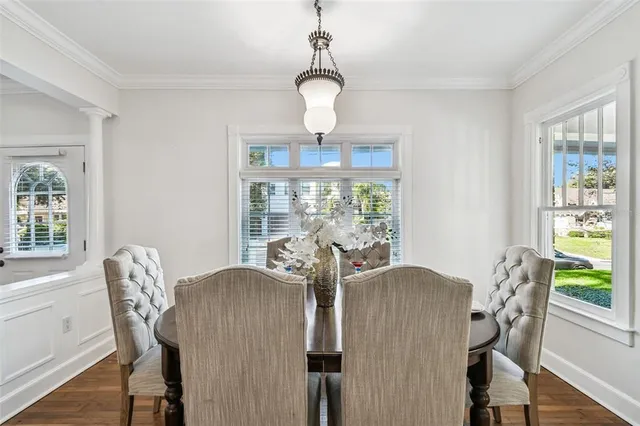 a view of a dining room with furniture window and wooden floor