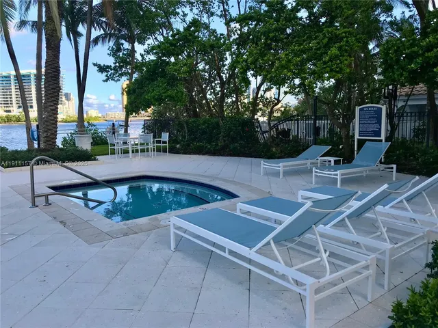 a view of living room with furniture and a chandelier