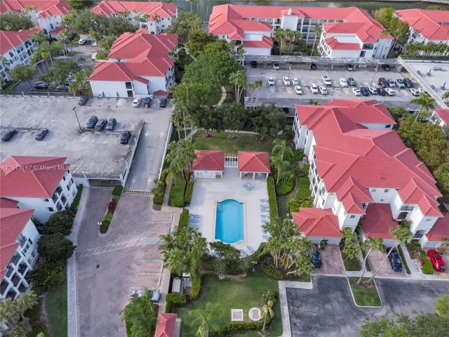 a view of a house with a patio and a yard