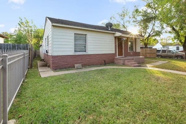 a front view of house with yard and seating area