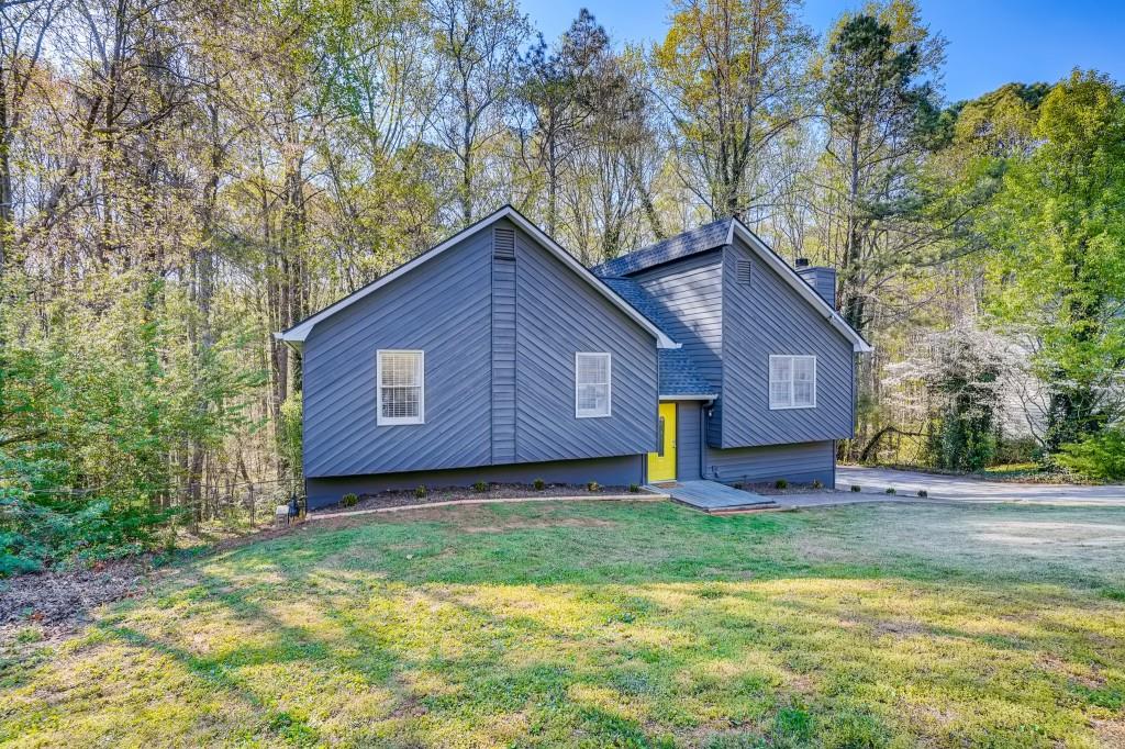 5150 Shadow Wood Drive Canton, GA 30114 - Photo 1 of 1 a view of backyard of house with green space
