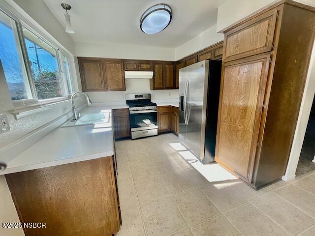 1012 West Anthony Way Lompoc, CA 93436 - Photo 17 of 38 a kitchen with stainless steel appliances a refrigerator and a stove