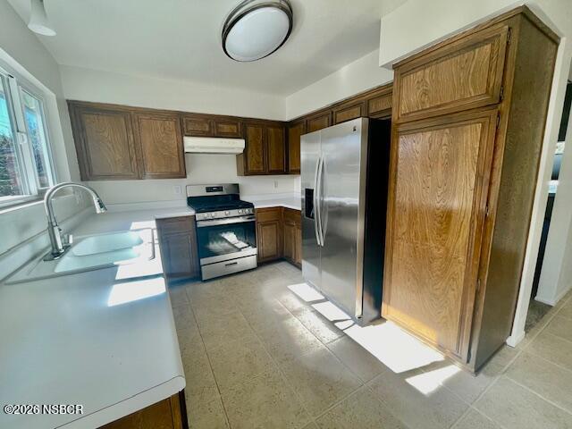 1012 West Anthony Way Lompoc, CA 93436 - Photo 19 of 38 a kitchen with stainless steel appliances granite countertop a refrigerator and a sink