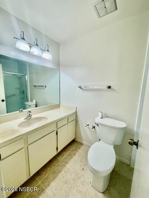 1012 West Anthony Way Lompoc, CA 93436 - Photo 23 of 38 a bathroom with a sink toilet and a mirror