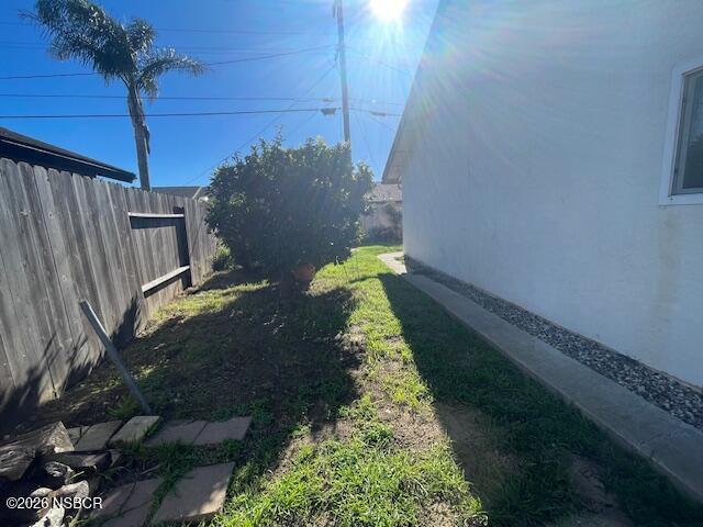 1012 West Anthony Way Lompoc, CA 93436 - Photo 37 of 38 a view of a yard with wooden fence