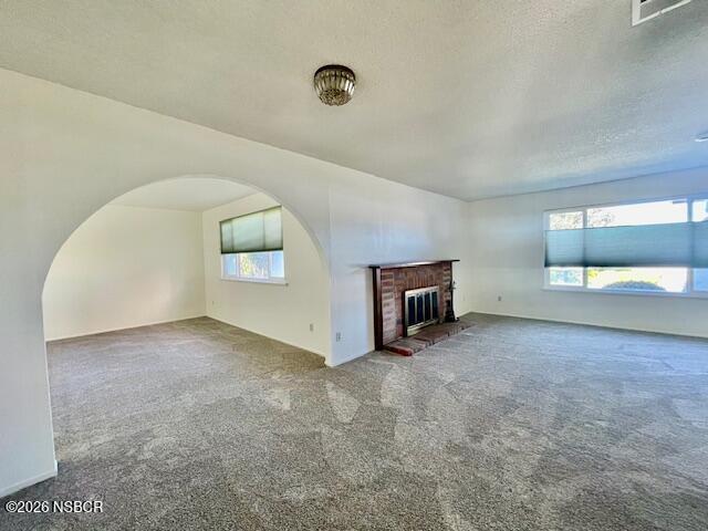 1012 West Anthony Way Lompoc, CA 93436 - Photo 7 of 38 an empty room with a fireplace and a window