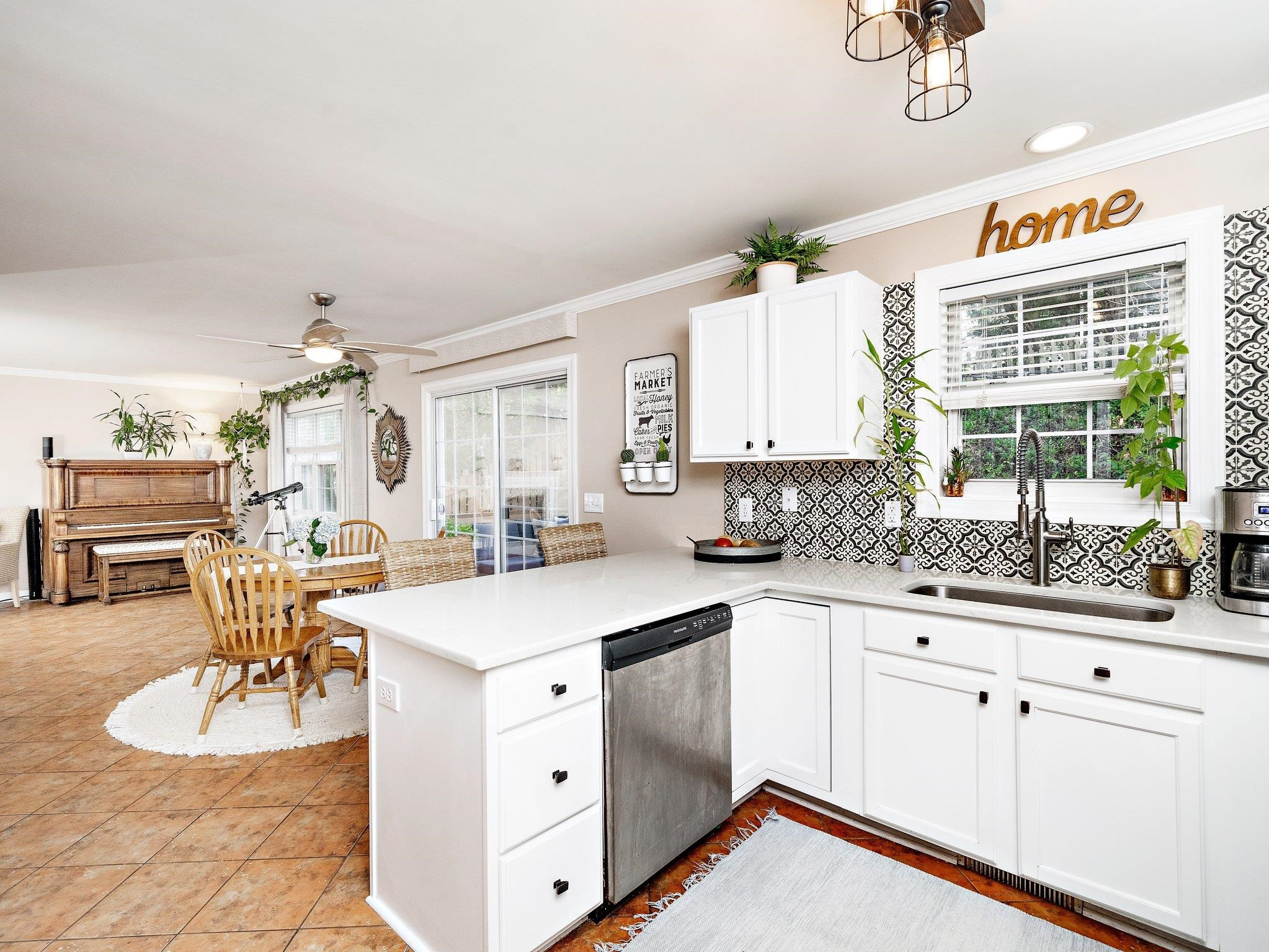 8312 Hobhouse Circle Raleigh, NC 27615 - Photo 11 of 39 a kitchen with white cabinets and sink